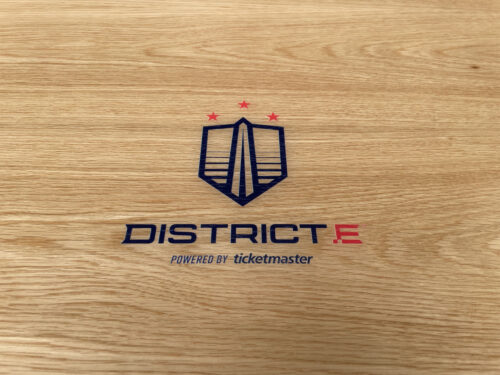 White Oak Veneer with Customers Logo Printed in Center and Red Powder Coated Metal Edges